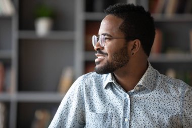 Smiling young mixed race man planning new day.