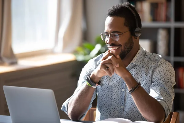 Smiling biracial businessman holding video call with clients partners. — Stock Photo, Image