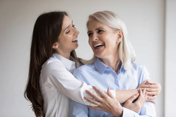 Happy mature mum and adult daughter have fun at home — Stock Photo, Image