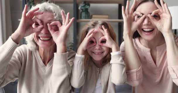 Happy funny multigenerational women family have fun make binoculars — Stock Video