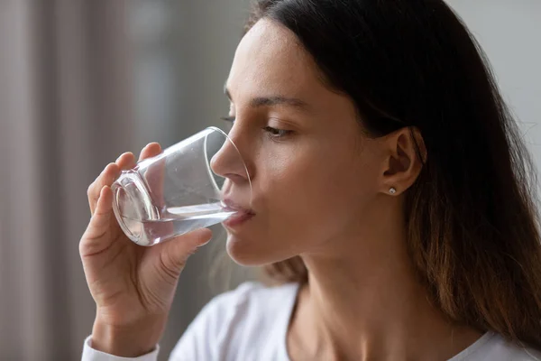 Caucasian girl hold glass drinking still mineral water — Stock Photo, Image