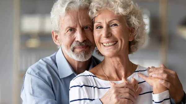 Portrait of happy mature couple hug showing love and care — Stock Photo, Image