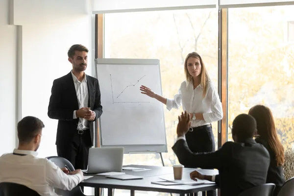 Two young speakers trainers holding educational seminar. — Stock Photo, Image