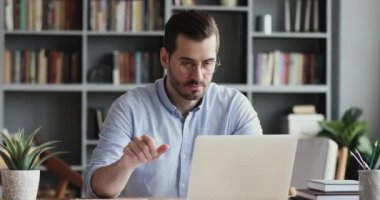 Stressed business man feel frustrated using laptop at work