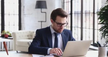 Overjoyed businessman executive celebrates online project business success