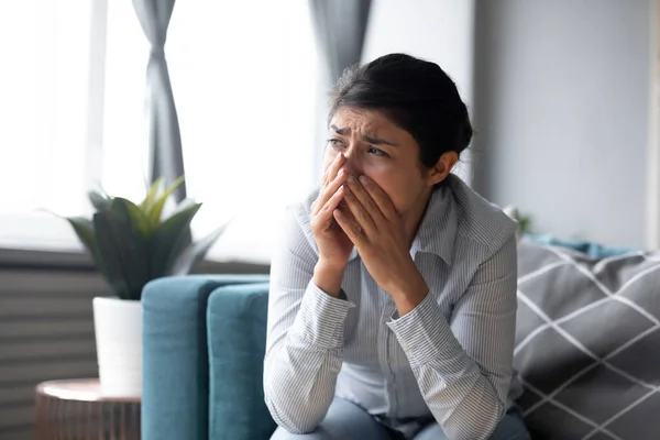 Depressed worried Indian woman crying alone, sitting on couch — Stock Photo, Image