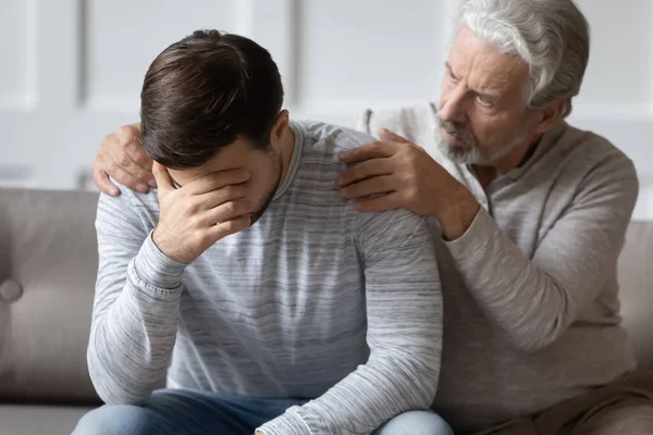 Caring elderly father comfort upset adult son — Stock Photo, Image