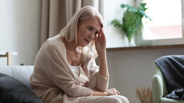 Stressed upset mature woman thinking of personal troubles. — Stock Photo, Image