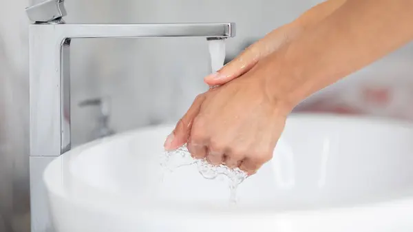 After toilet female washing hands using anti bacterial soap closeup — Stock Photo, Image