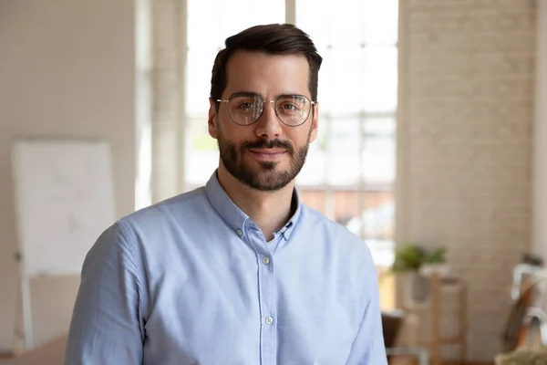 Headshot portrait successful businessman standing in office posing for camera — Stock Photo, Image