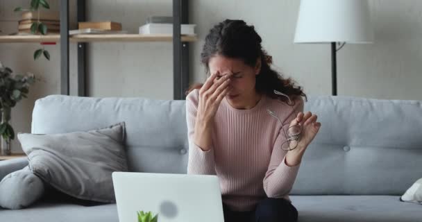 Exhausted woman taking off glasses feeling eye strain from computer — Stock Video