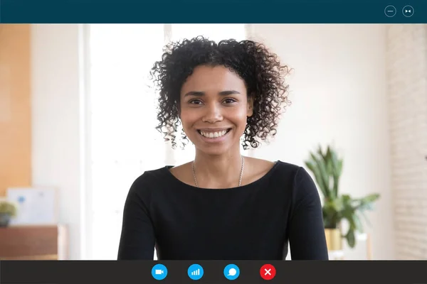 Headshot of biracial woman talk on web conference