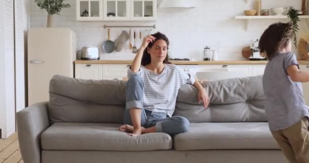 Tired upset young mother feel frustrated about active noisy kids — Stock Video