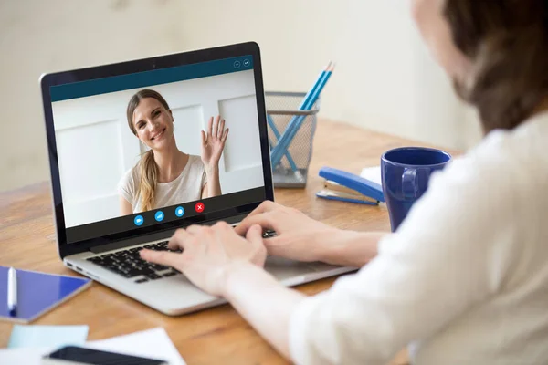 Young woman talk on video call with female friend — Stock Photo, Image