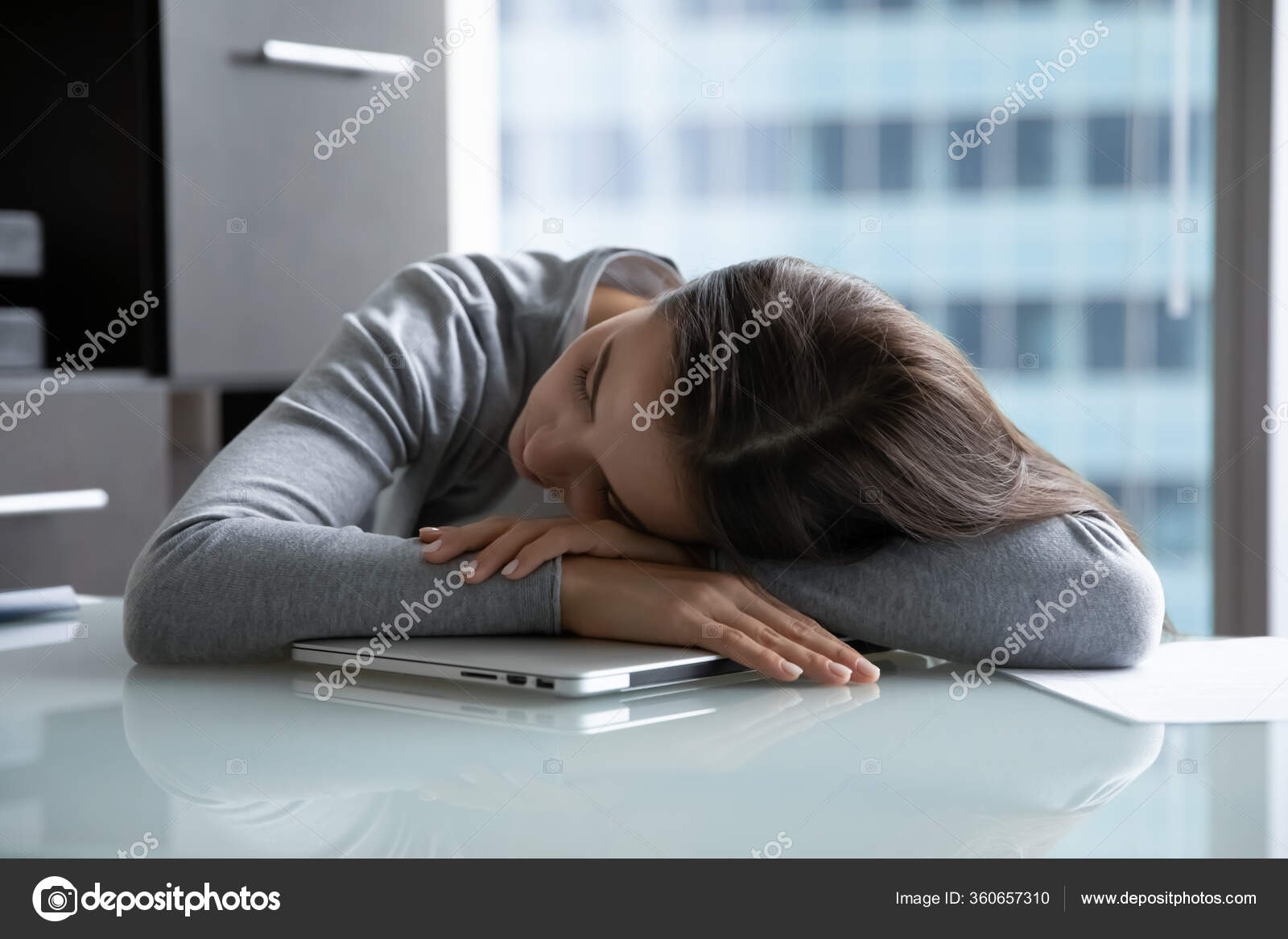 Tired Female Employee Fall Asleep At Workplace Stock Photo