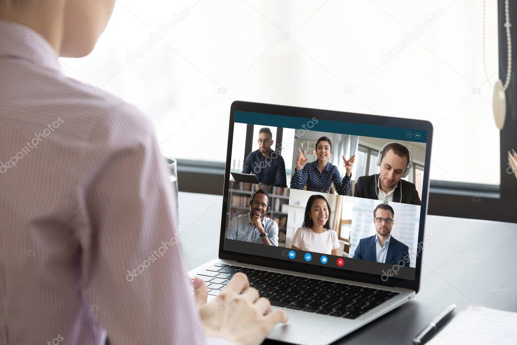 Computer screen view during group video call with multiethnic colleagues