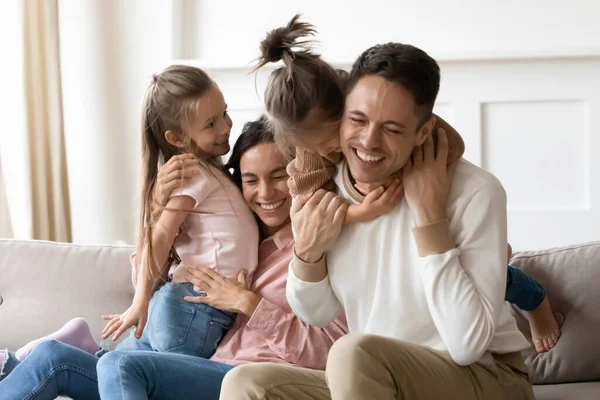 Overjoyed little children playing with happy parents. — Stock Photo, Image