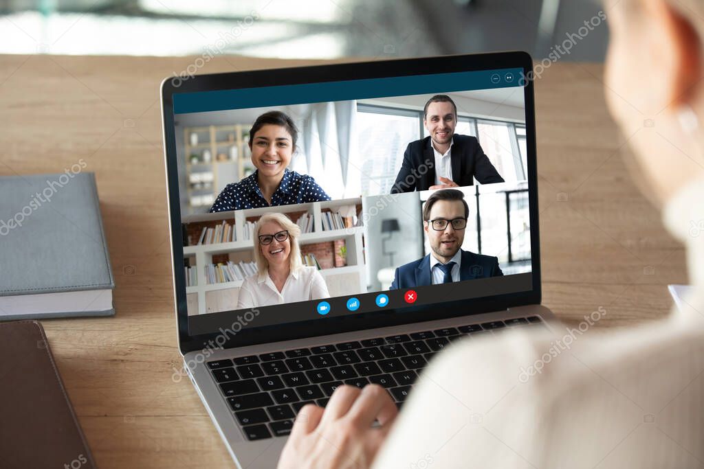 Computer screen view diverse businesspeople negotiating distantly using videocall