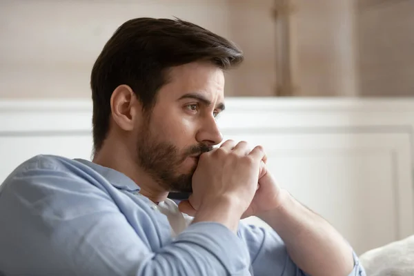 Close up head shot young thoughtful man looking away. — Stock Photo, Image