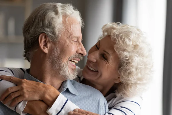 Close up smiling older couple hugging, enjoying tender moment — Stock Photo, Image