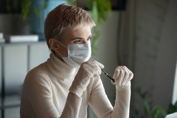 Pensive woman in protective gear look in distance pondering — Stock Photo, Image