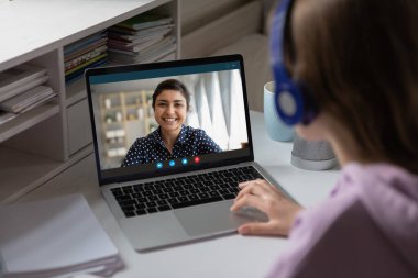 Indian teacher share knowledge with learner using videoconference videocall clipart