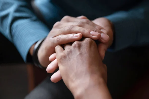 Multiethnic couple hold hands sharing close intimate moment together — Stock Photo, Image