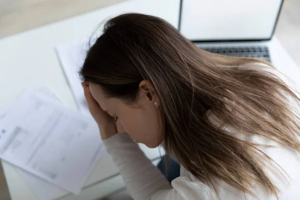 Depressed young woman frustrated about finance problem