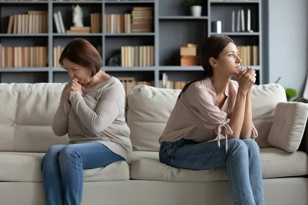 Stubborn adult daughter and mature mother ignoring each other — Stock Photo, Image