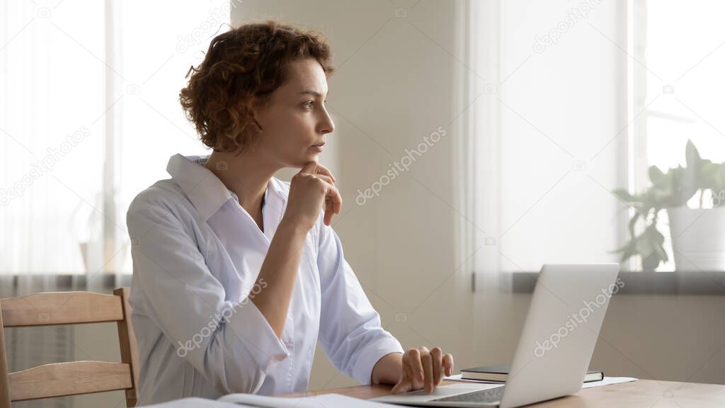 Thoughtful female doctor thinking of medical question at workplace