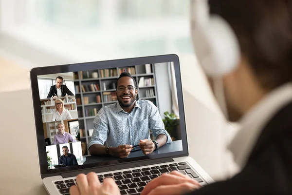 Male employee talk on video call with diverse colleagues — Stock Photo, Image