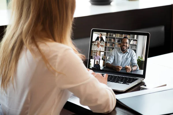 Back view of female employee have web conference with colleagues — Stock Photo, Image