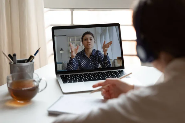 Millennial girl employee talk on video call with female colleague — Stock Photo, Image