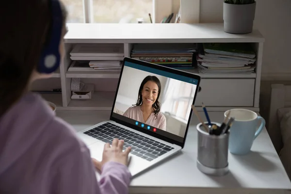 Teen girl have online lesson on computer with teacher — Stock Photo, Image