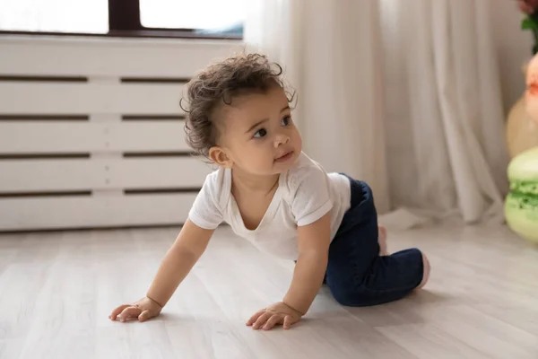 Little biracial baby creep on fours at home — Stock Photo, Image