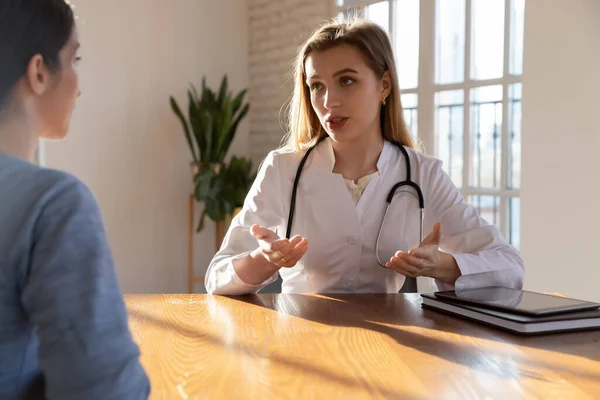 Female doctor consult woman patient at hospital appointment — Stock Photo, Image