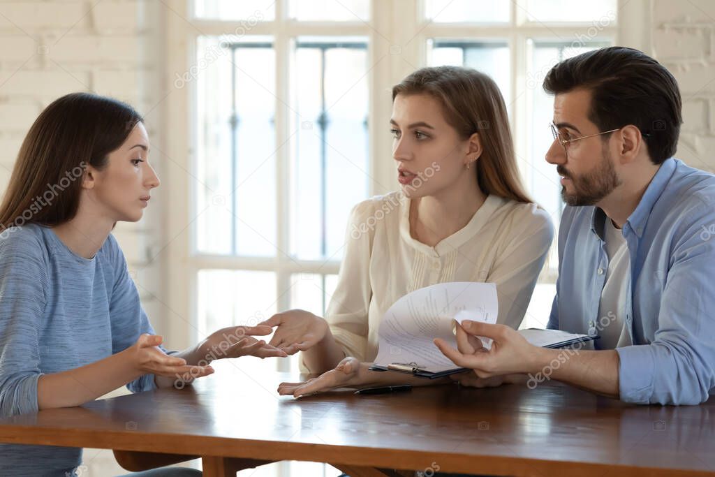 Angry couple argue with realtor about contract rules