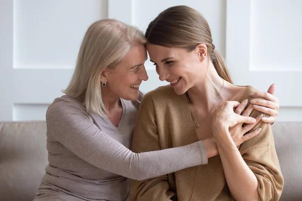 Happy mature mom and adult daughter hugging — Stock Photo, Image