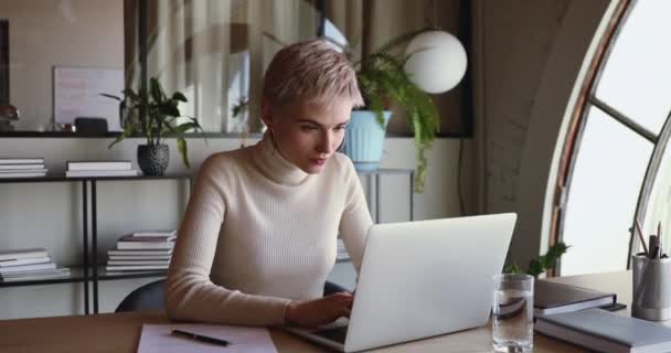 Excited young businesswoman winner celebrating online win looking at laptop — Stock Video