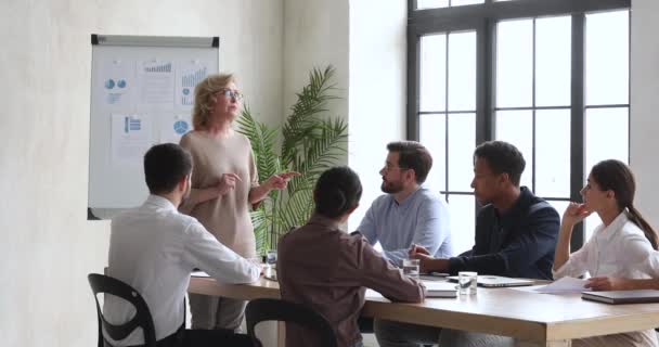 Mixed race employees negotiating briefing project at office. — Stock Video