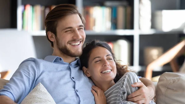 Happy young couple look in distance dreaming — Stock Photo, Image