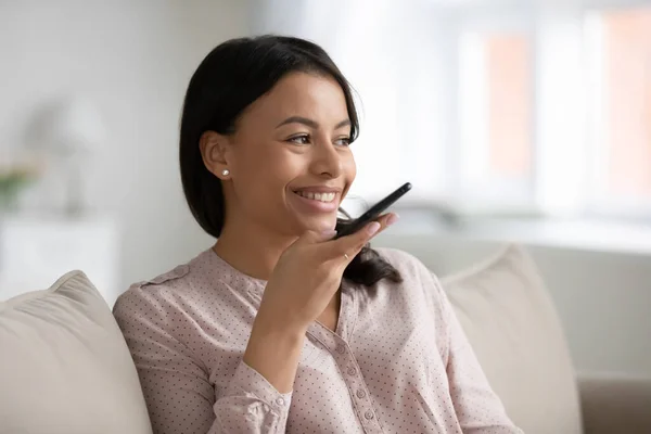 African woman hold smartphone talking with friend use speakerphone — Stock Photo, Image