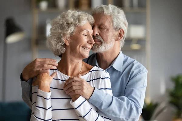 Happy older 60s family couple show love care devotion. — Stock Photo, Image