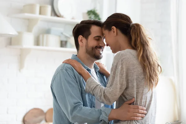 Happy young couple enjoy romantic moment in kitchen — Stock Photo, Image