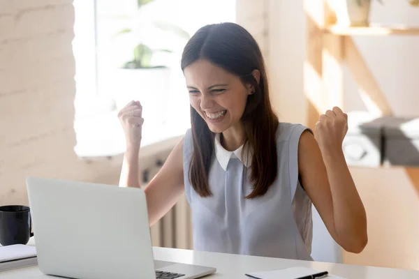 Overjoyed young woman feel excited read good news on laptop — Stock Photo, Image