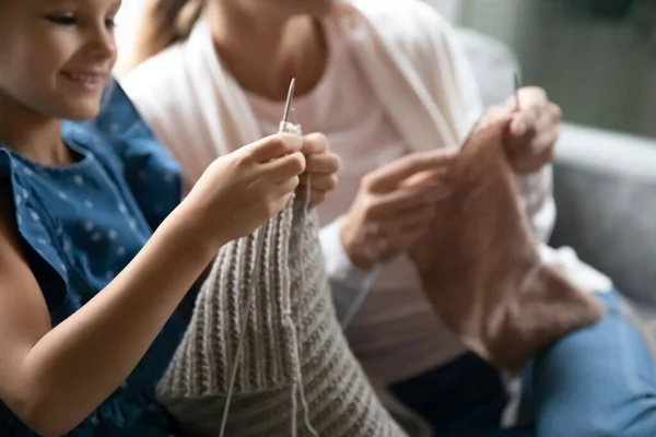 Close up of mother and daughter knit together — Stock Photo, Image