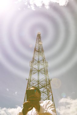 Woman with smartphone near telecommunication tower clipart