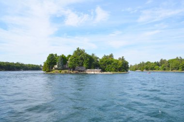 Island with house in Thousand Islands Region clipart