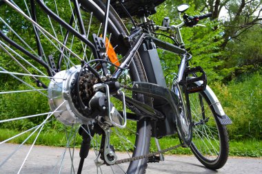 Electric bicycle in the park clipart