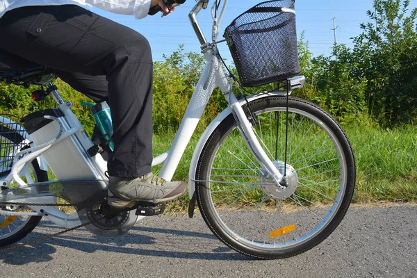 Riding e-bike or electric bicycle,